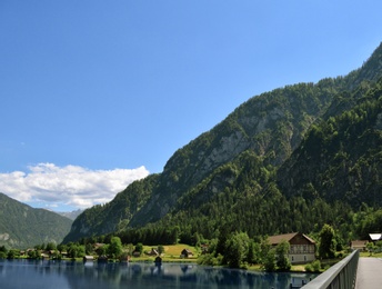 Beautiful landscape with mountains and river on sunny day