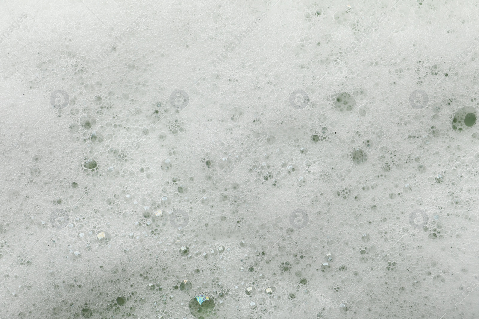 Photo of Fluffy soap foam as background, closeup view