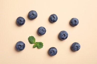 Flat lay composition with tasty blueberry on color background