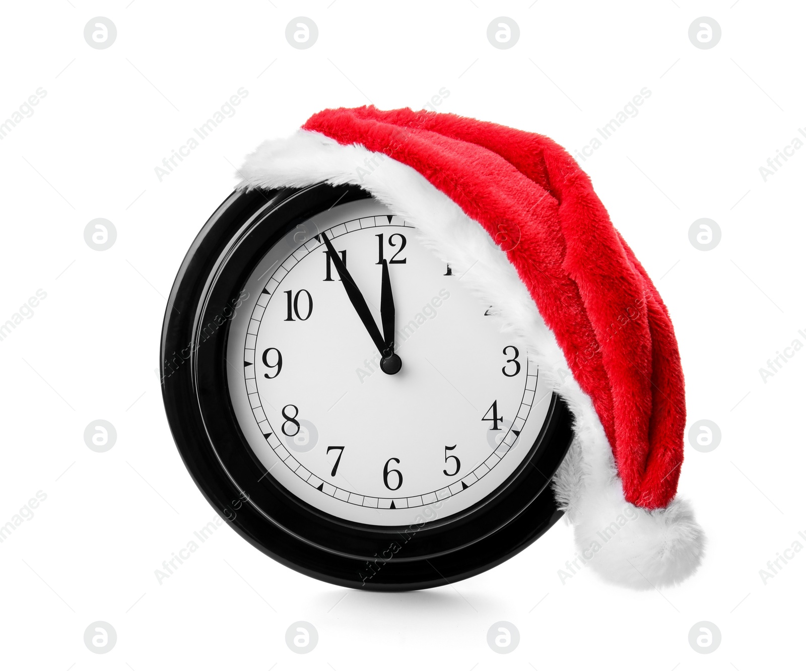 Photo of Clock with Santa hat on white background. Christmas countdown