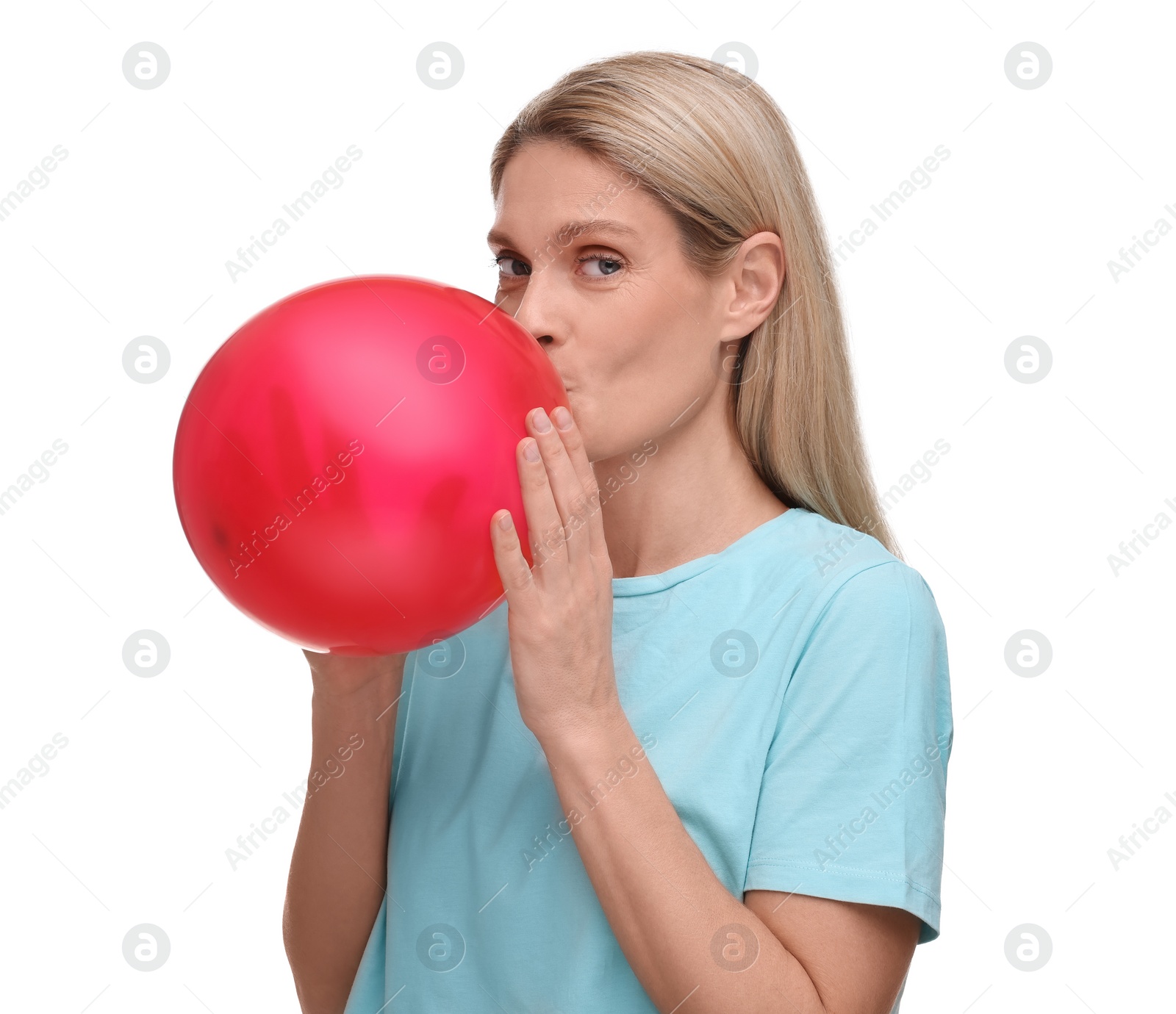 Photo of Woman blowing up balloon on white background