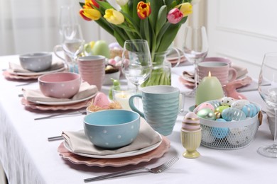 Photo of Festive table setting with beautiful flowers. Easter celebration