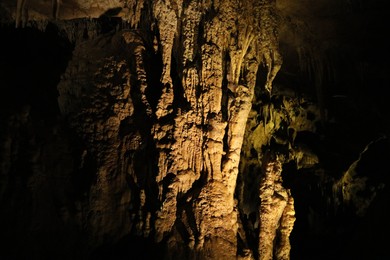 Picturesque view of many stalactite and stalagmite formations in cave