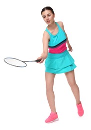 Young woman playing badminton with racket on white background