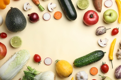 Photo of Flat lay composition with fresh vegetables and fruits on color background. Space for text