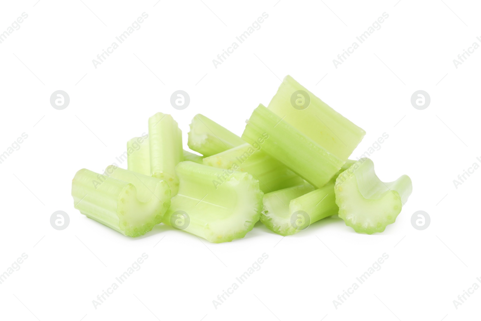 Photo of Heap of fresh cut celery isolated on white
