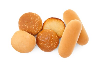Photo of Tasty fresh burger and hotdog buns isolated on white, top view