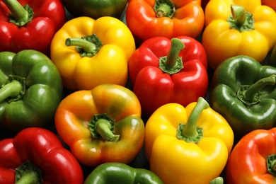 Photo of Colorful paprika peppers as background, closeup