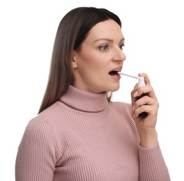 Woman using throat spray on white background