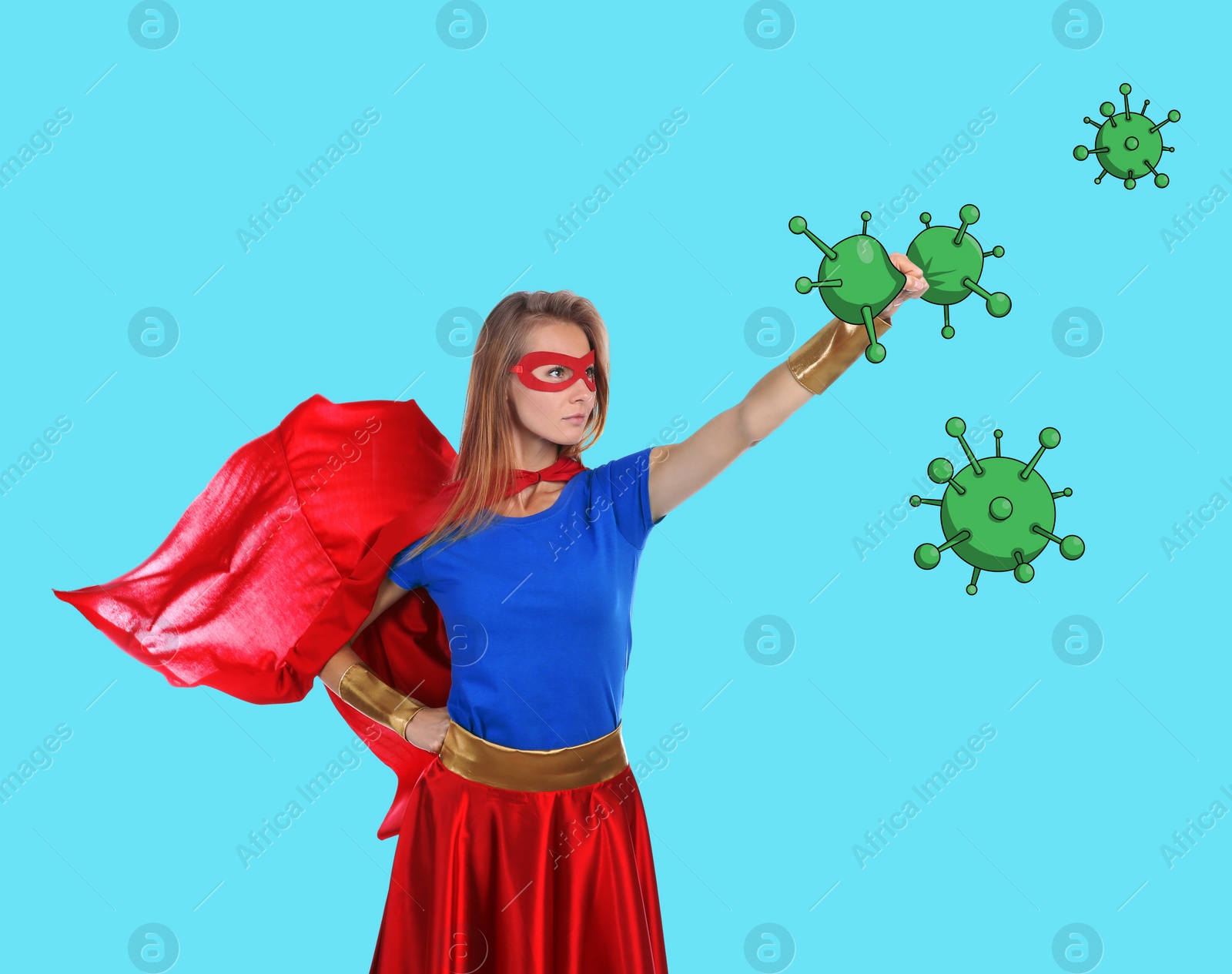 Image of Young woman wearing superhero costume fighting against viruses on turquoise background