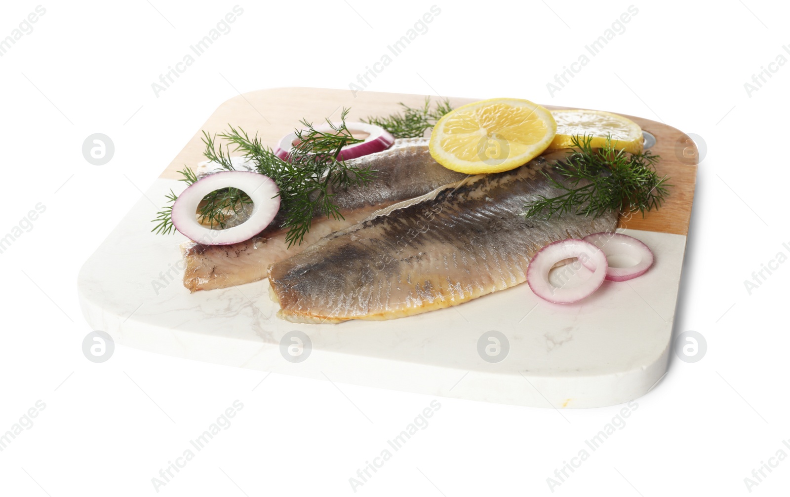 Photo of Board with delicious salted herring fillets, onion rings, dill and lemon isolated on white