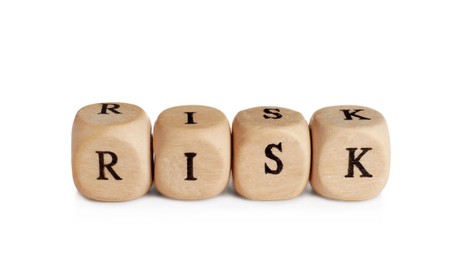 Photo of Word Risk made of small wooden cubes on white background