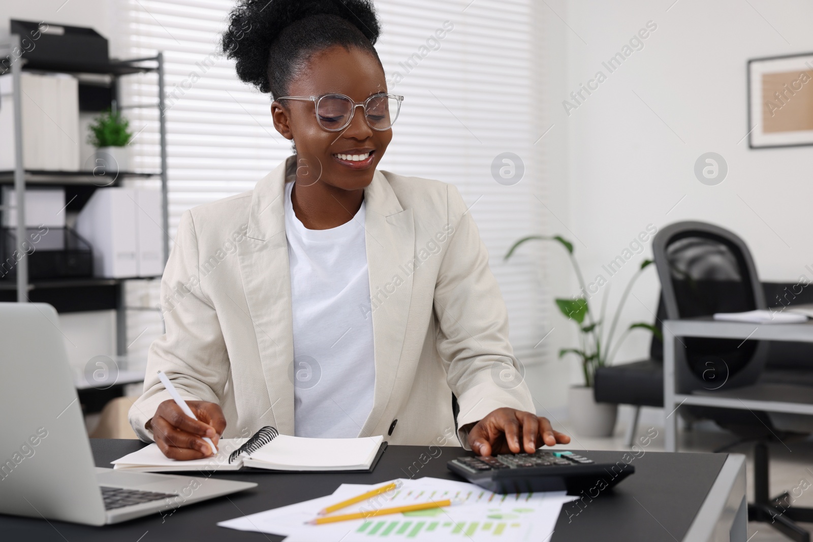 Photo of Professional accountant working at desk in office