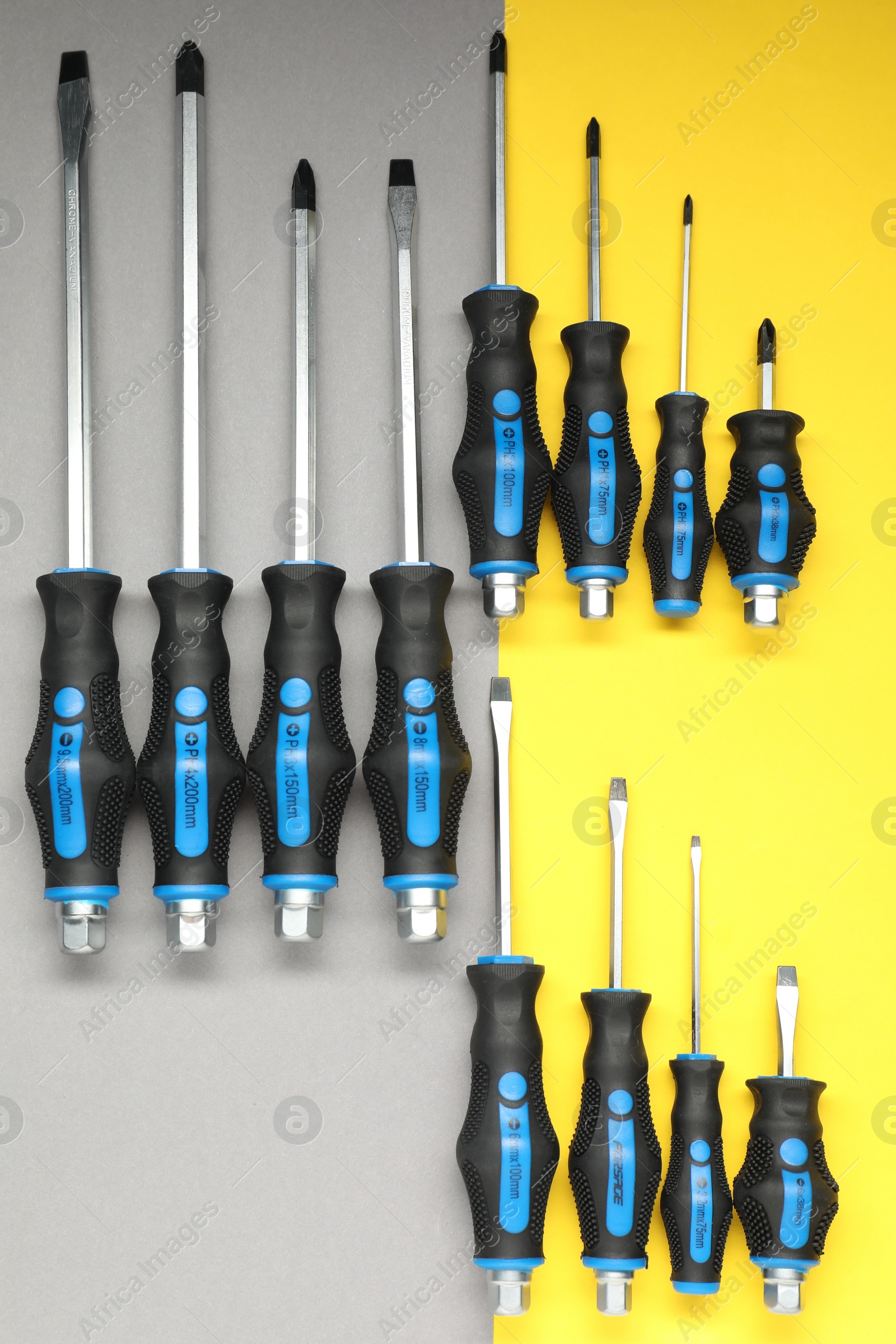 Photo of Set of screwdrivers on color background, flat lay