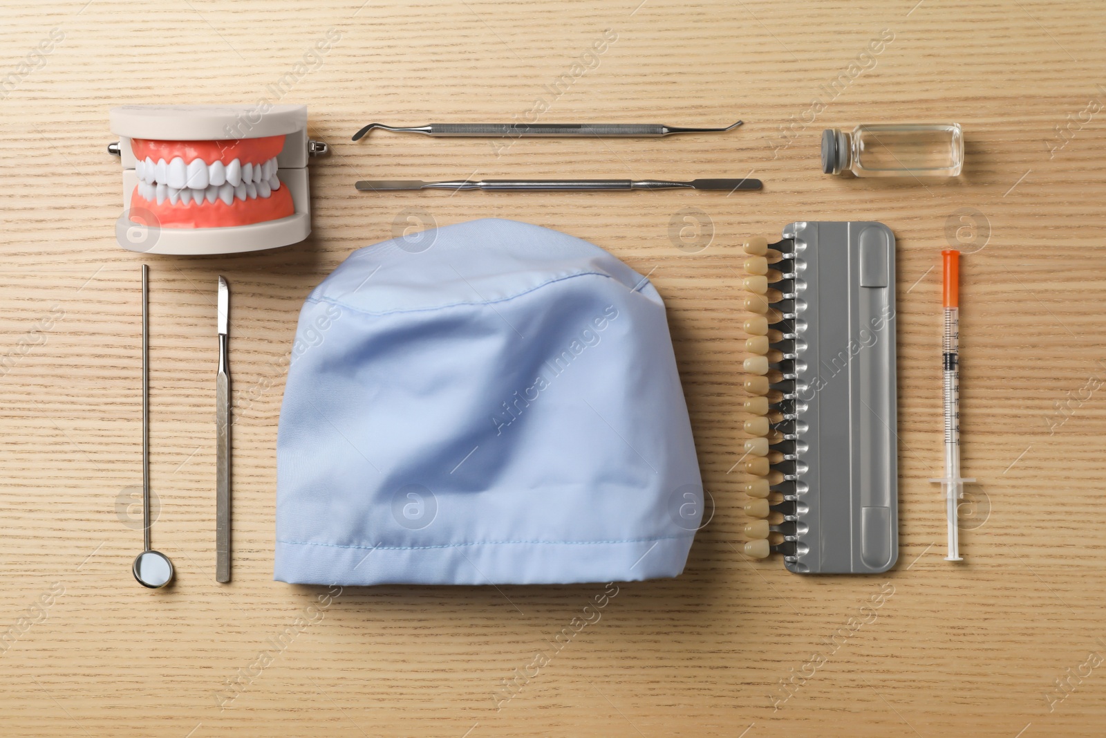Photo of Flat lay composition with medical objects on wooden background