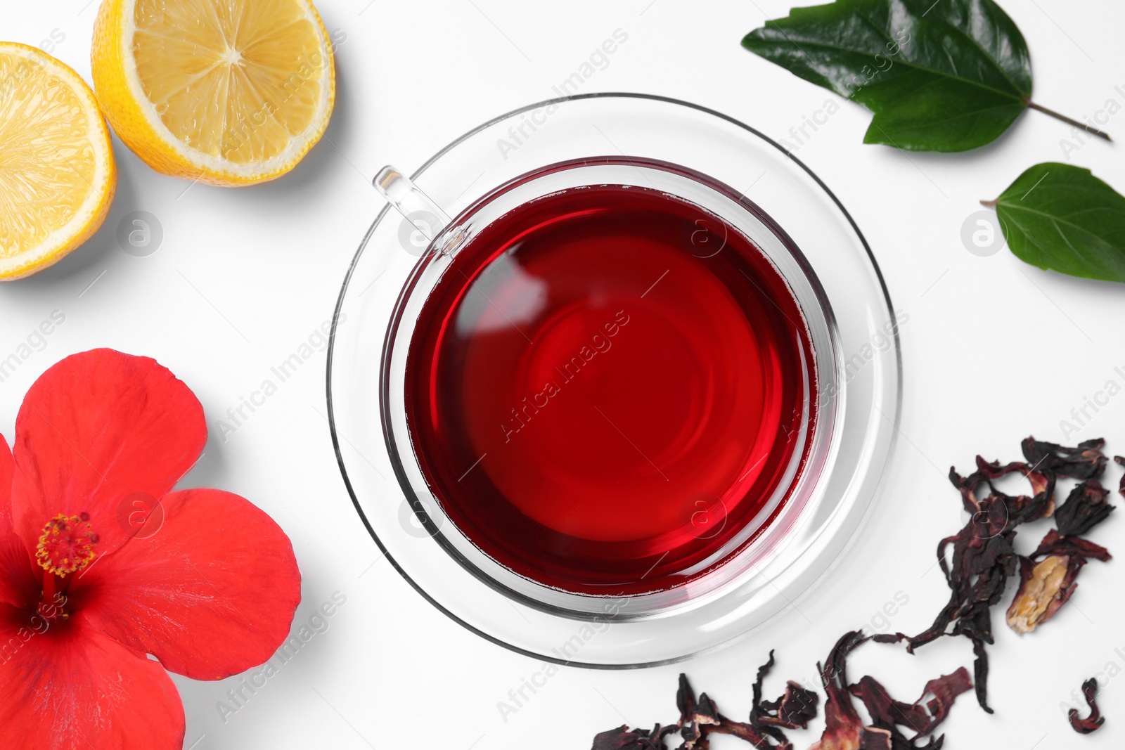Photo of Flat lay composition with delicious hibiscus tea on white background