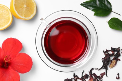Flat lay composition with delicious hibiscus tea on white background