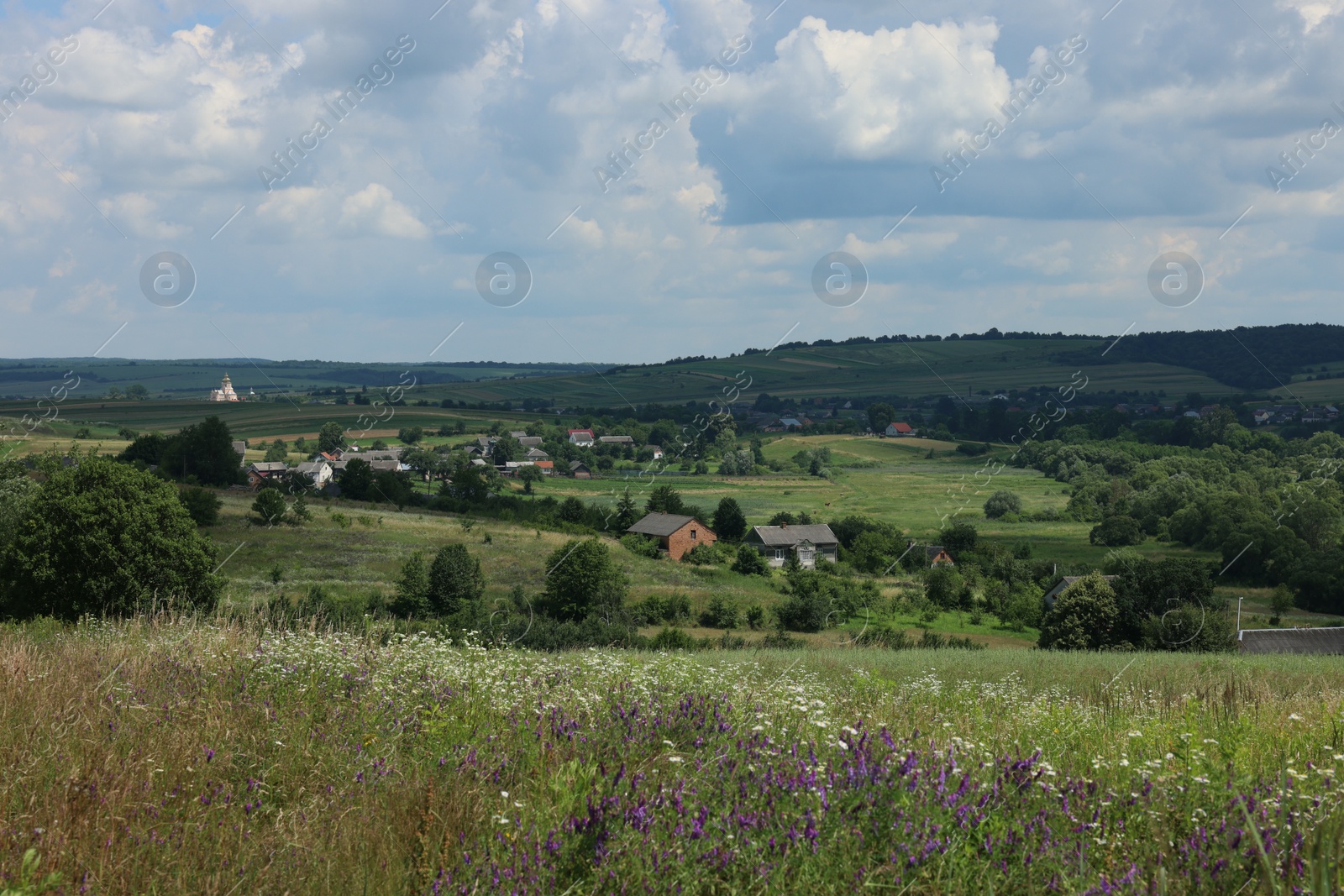 Photo of Beautiful landscape with village in mountains under blue sky