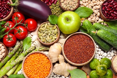 Different vegetables, seeds and fruits as background, closeup. Healthy diet