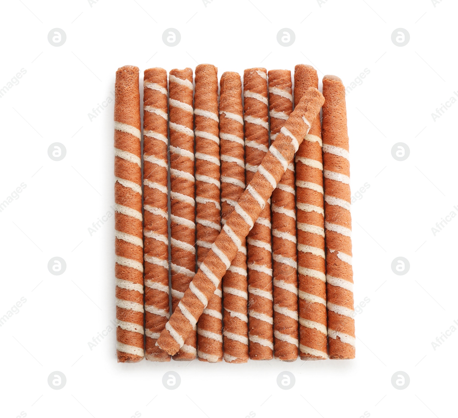 Photo of Delicious chocolate wafer rolls on white background, top view. Sweet food