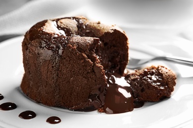 Delicious fresh fondant with hot chocolate served on plate. Lava cake recipe