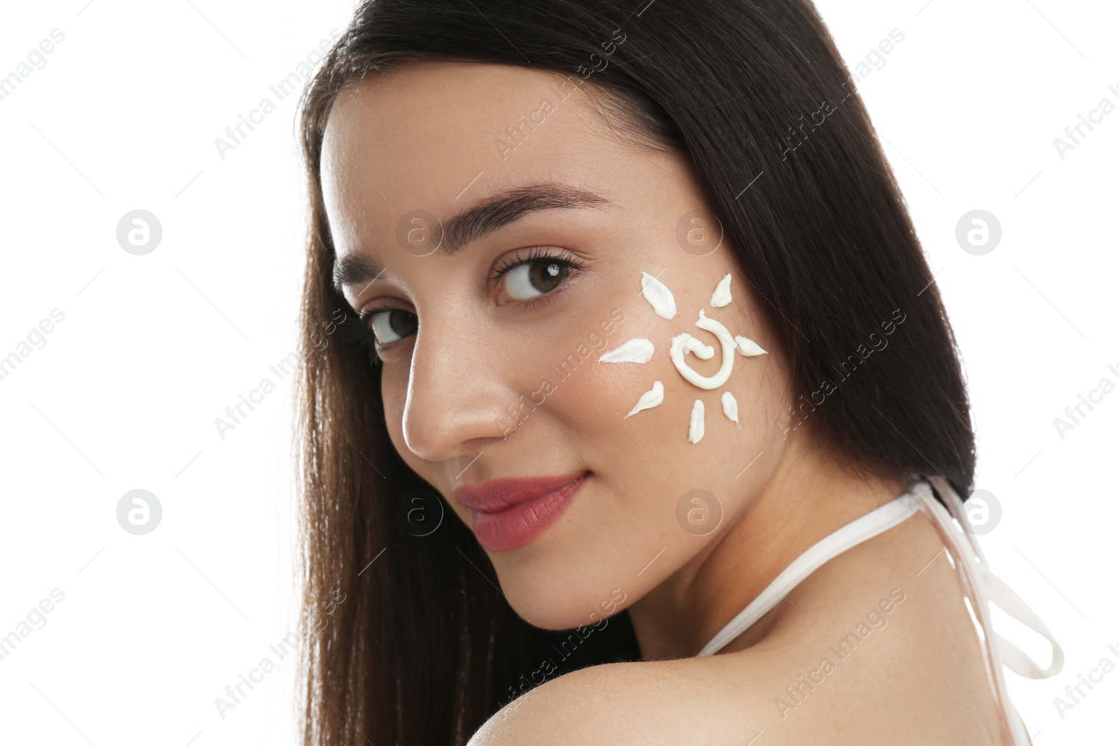 Photo of Young woman with sun protection cream on her face against white background