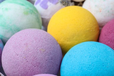 Photo of Colorful bath bombs as background, closeup view