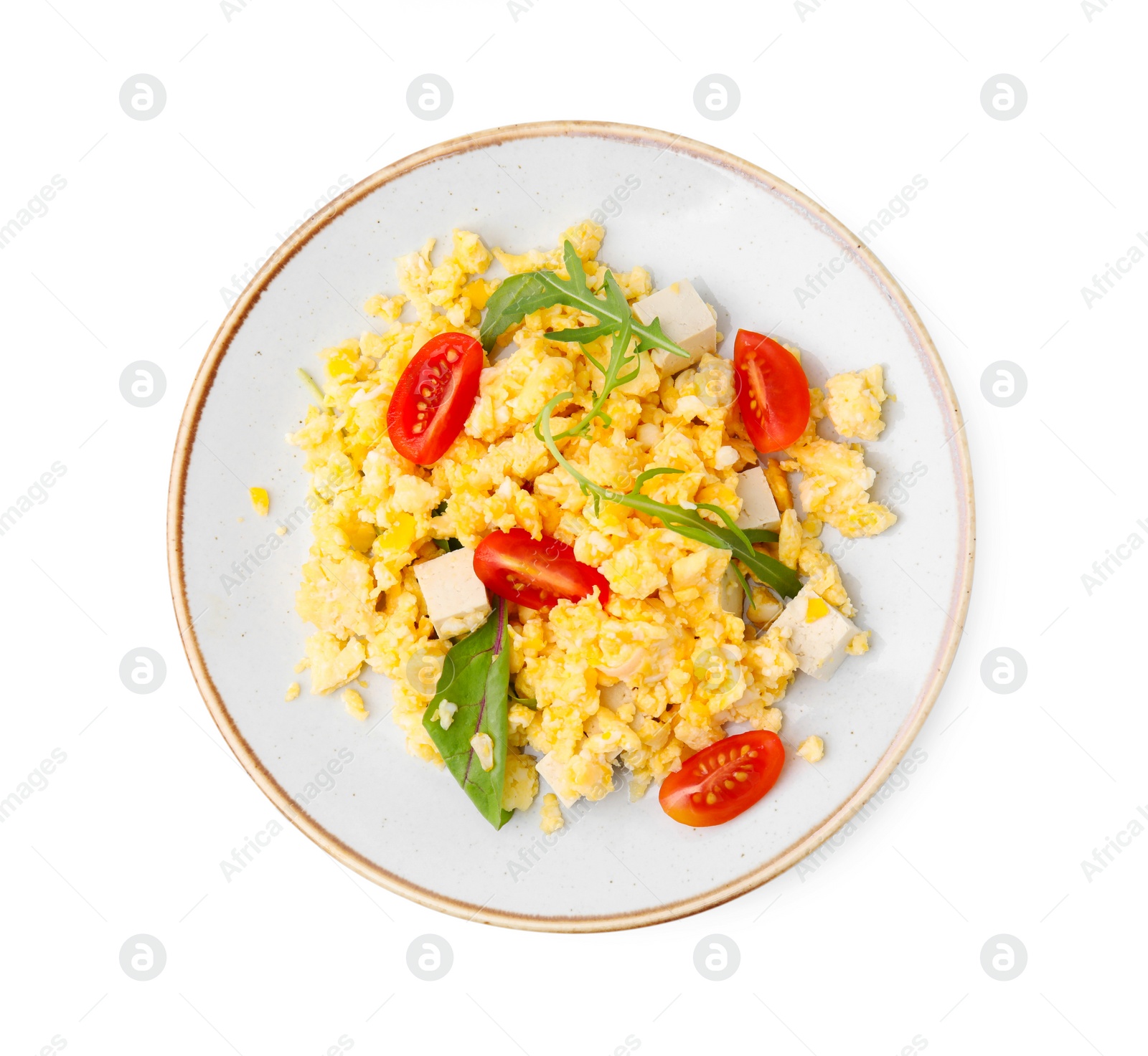 Photo of Plate of delicious scrambled eggs with tofu and tomatoes isolated on white, top view