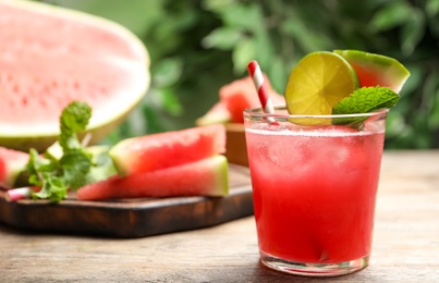 Photo of Delicious fresh watermelon drink on wooden table