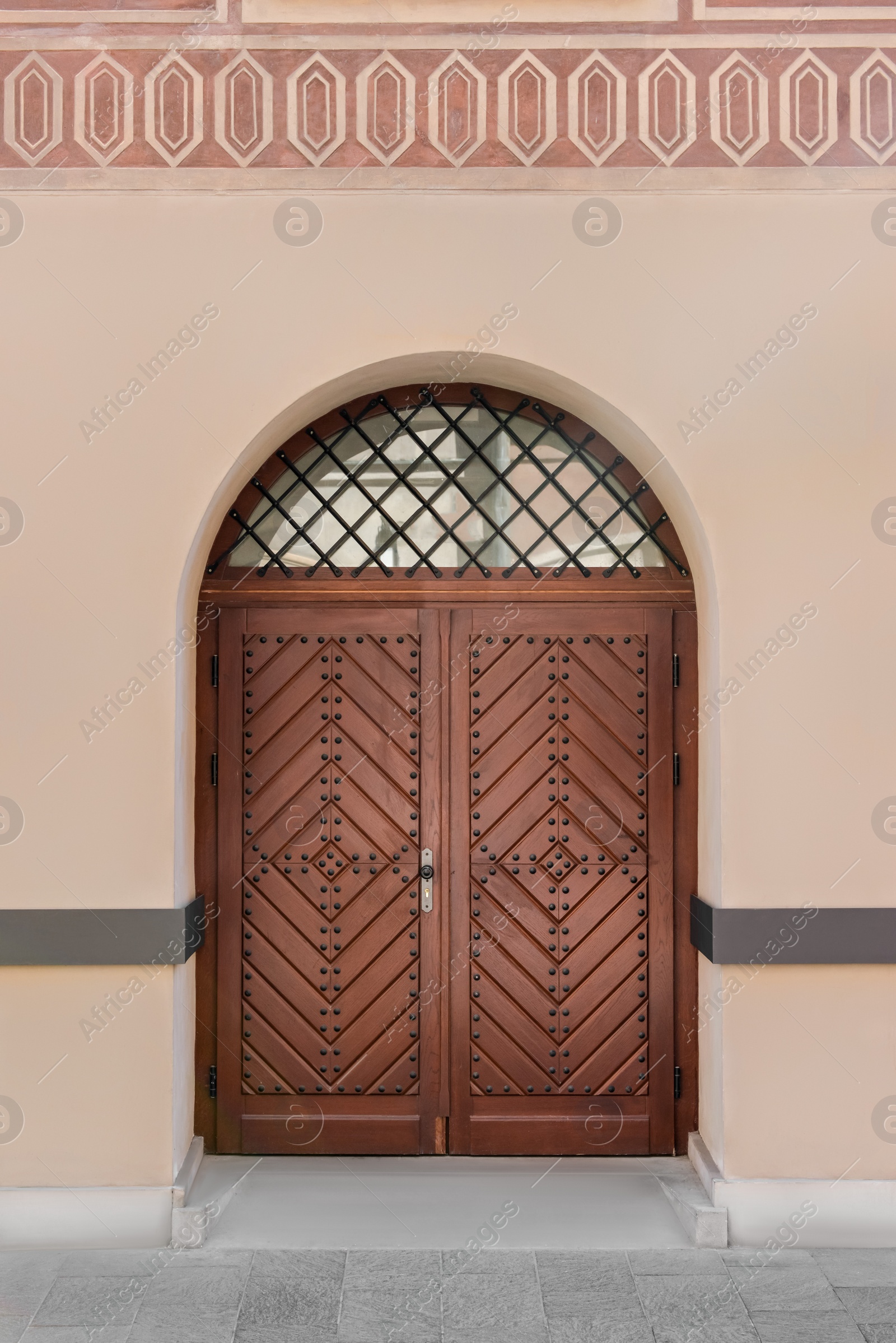 Photo of Entrance of building with brown wooden door