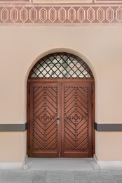 Entrance of building with brown wooden door