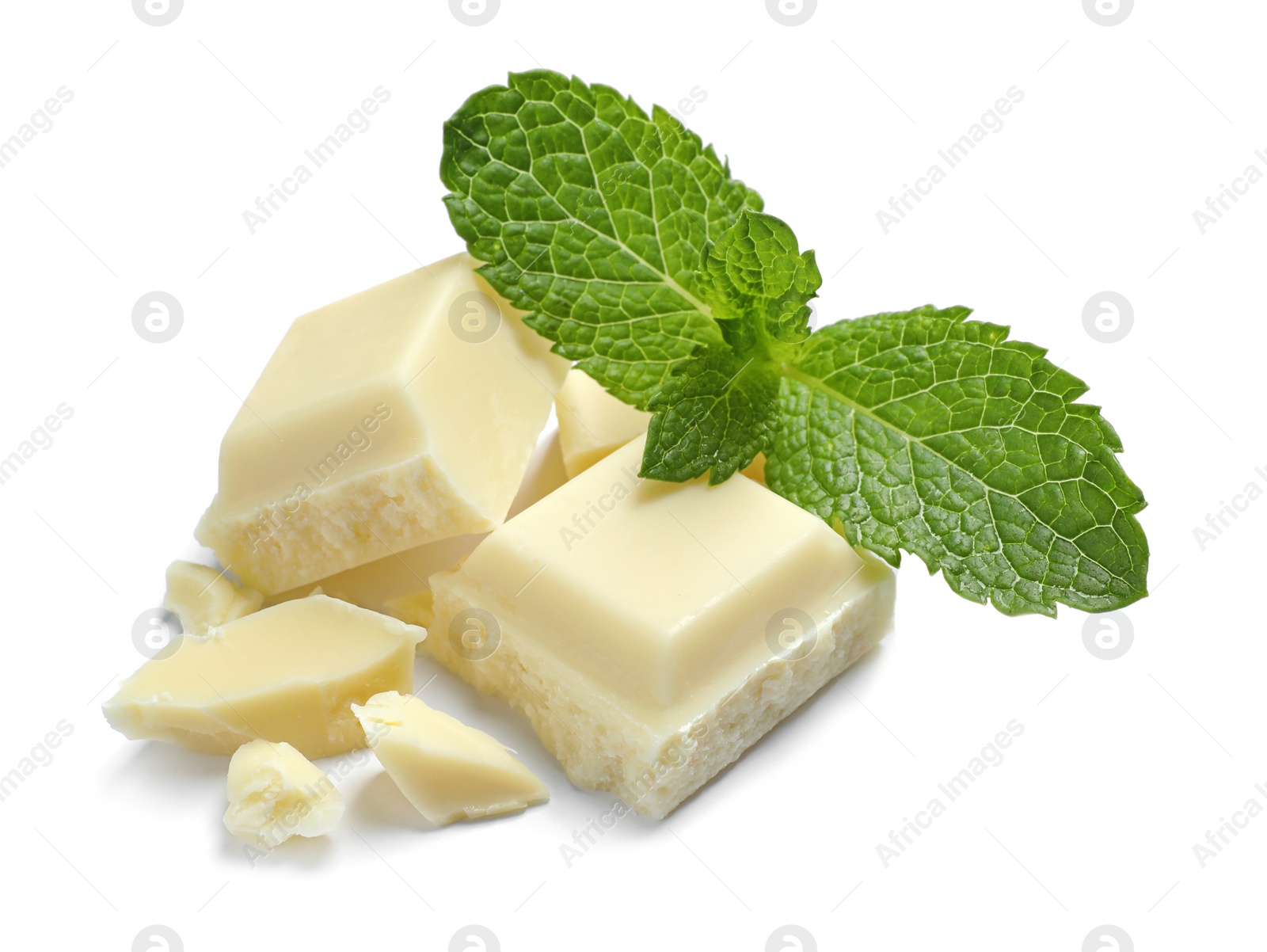 Photo of Pieces of white chocolate with mint on white background