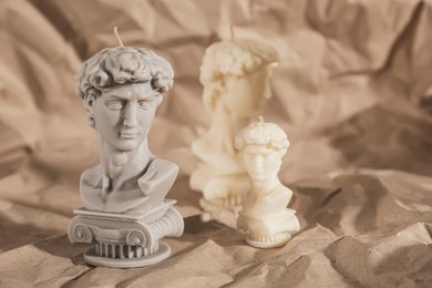 Photo of Beautiful David bust candles on crumpled paper