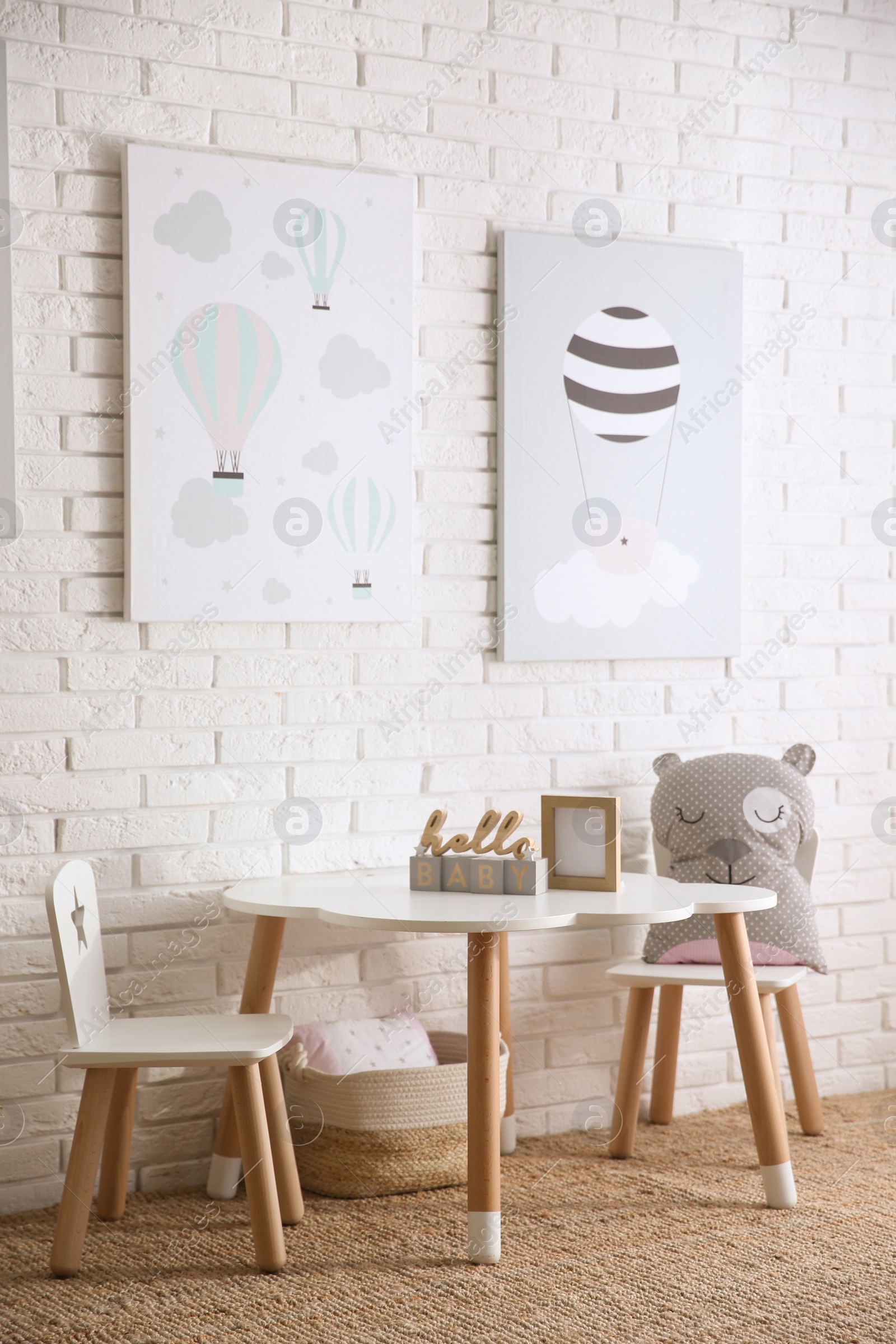 Photo of Baby room interior with toys and stylish furniture