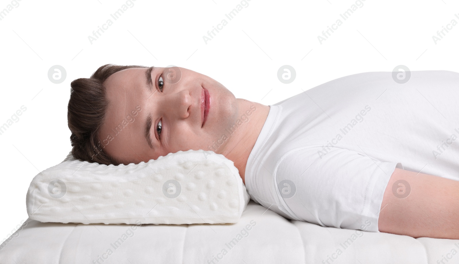 Photo of Man lying on orthopedic pillow against white background