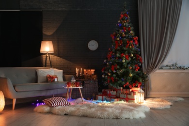 Photo of Stylish room interior with decorated Christmas tree