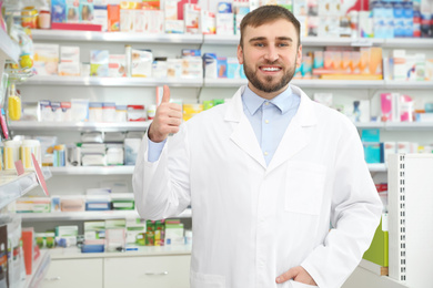 Portrait of professional pharmacist in modern drugstore