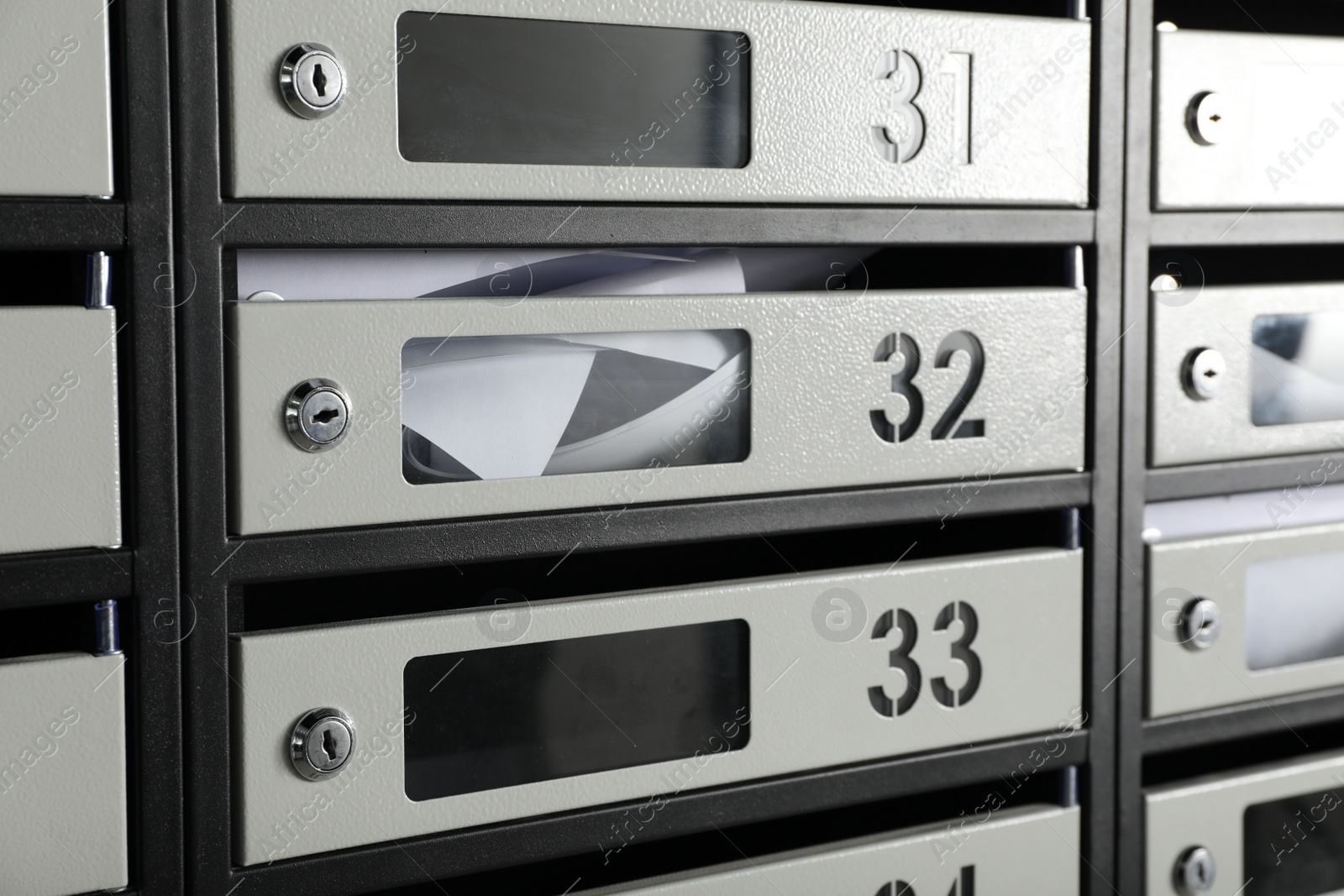 Photo of New mailboxes with keyholes, numbers and receipts as background