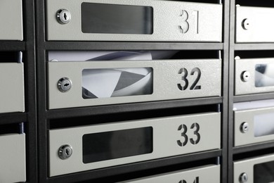 Photo of New mailboxes with keyholes, numbers and receipts as background