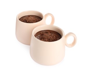 Cups of delicious hot chocolate on white background