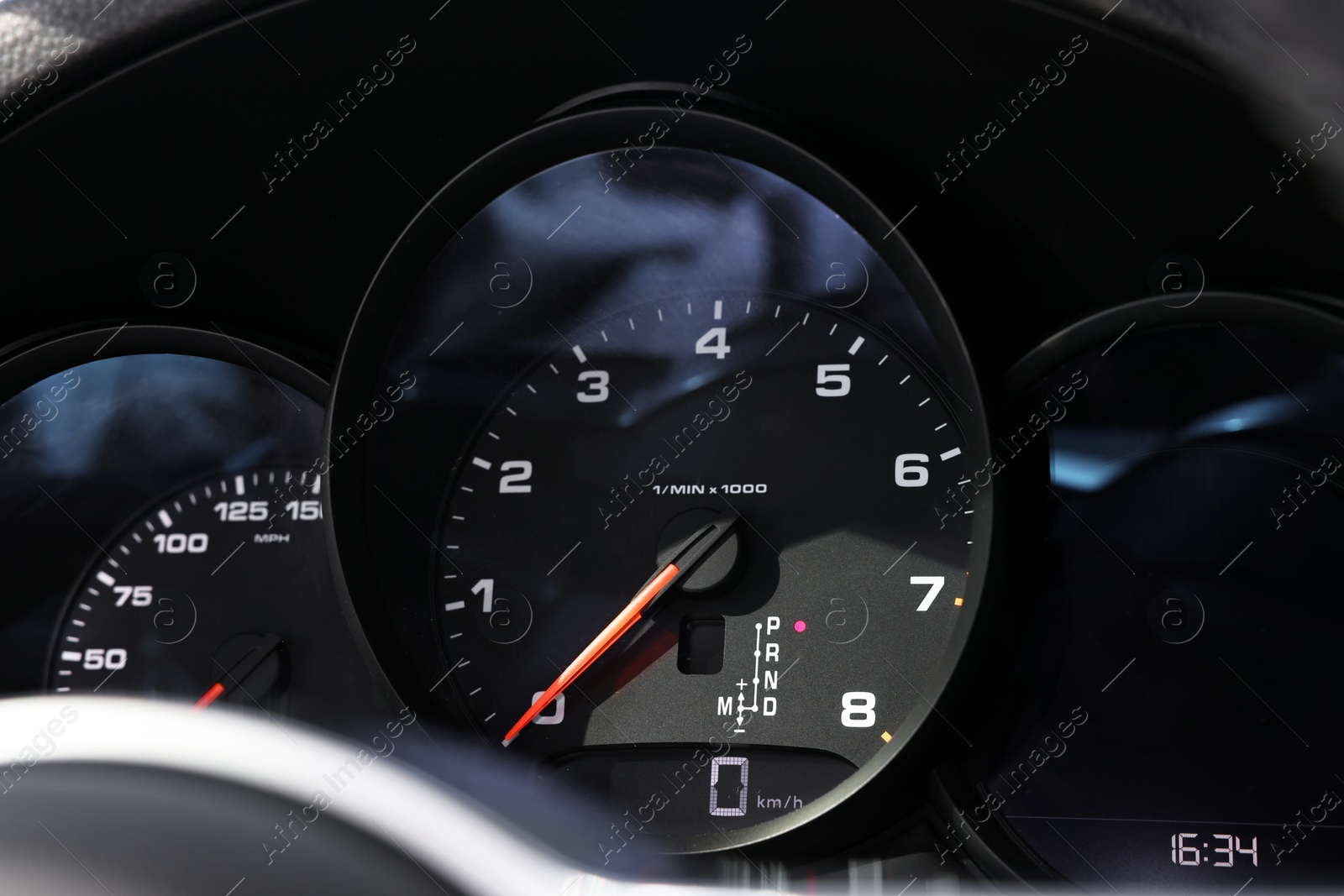 Photo of Speedometer and tachometer inside of modern car, closeup