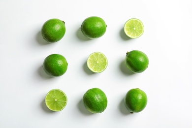 Fresh ripe limes on white background, top view