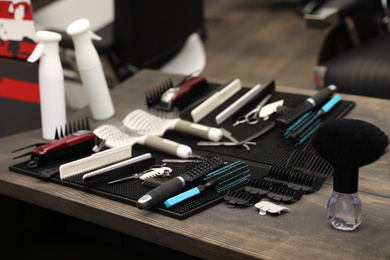 Photo of Hairdresser tools on table in barber shop