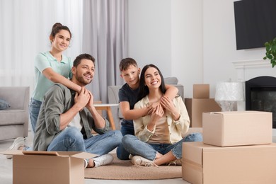 Photo of Happy family spending time in new apartment. Moving day