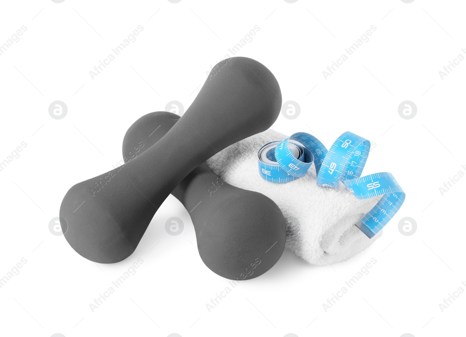 Photo of Dumbbells, towel and measuring tape isolated on white
