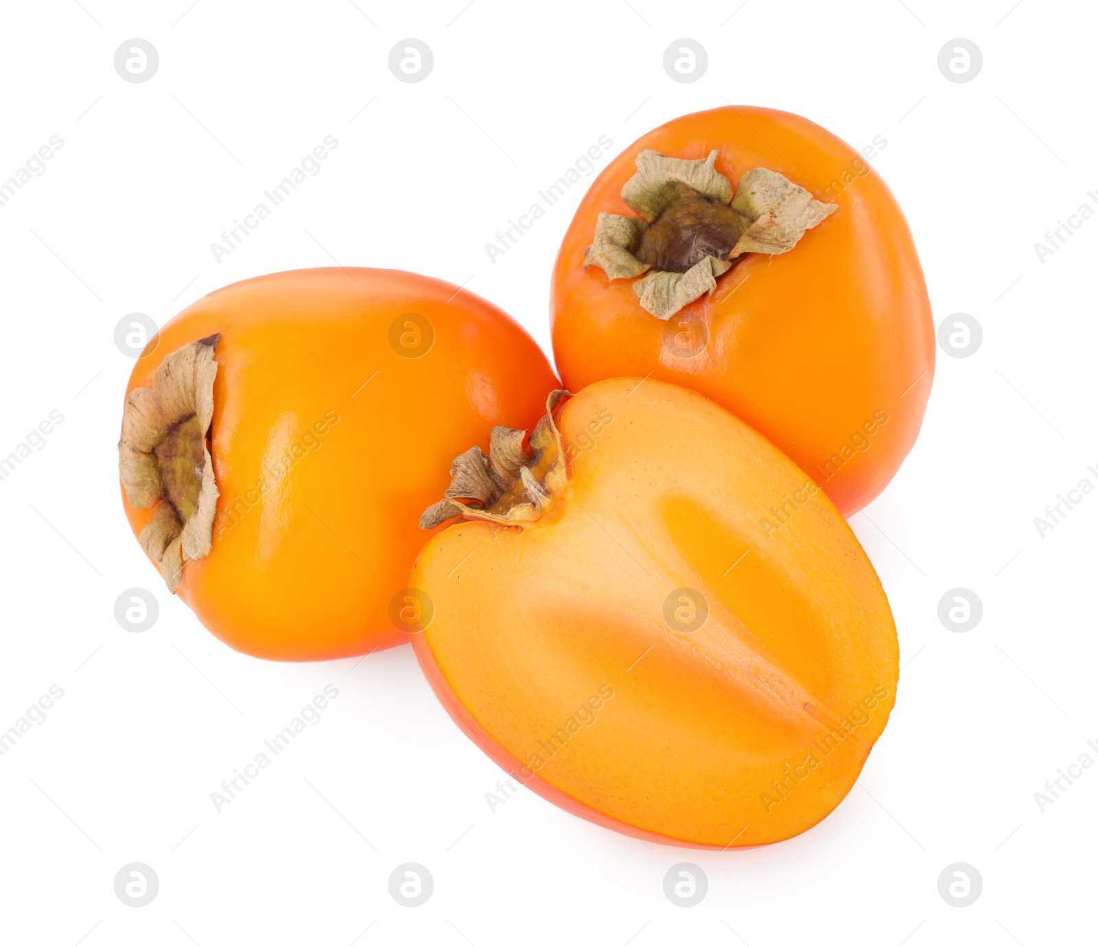 Photo of Whole and cut persimmon fruits isolated on white, above view