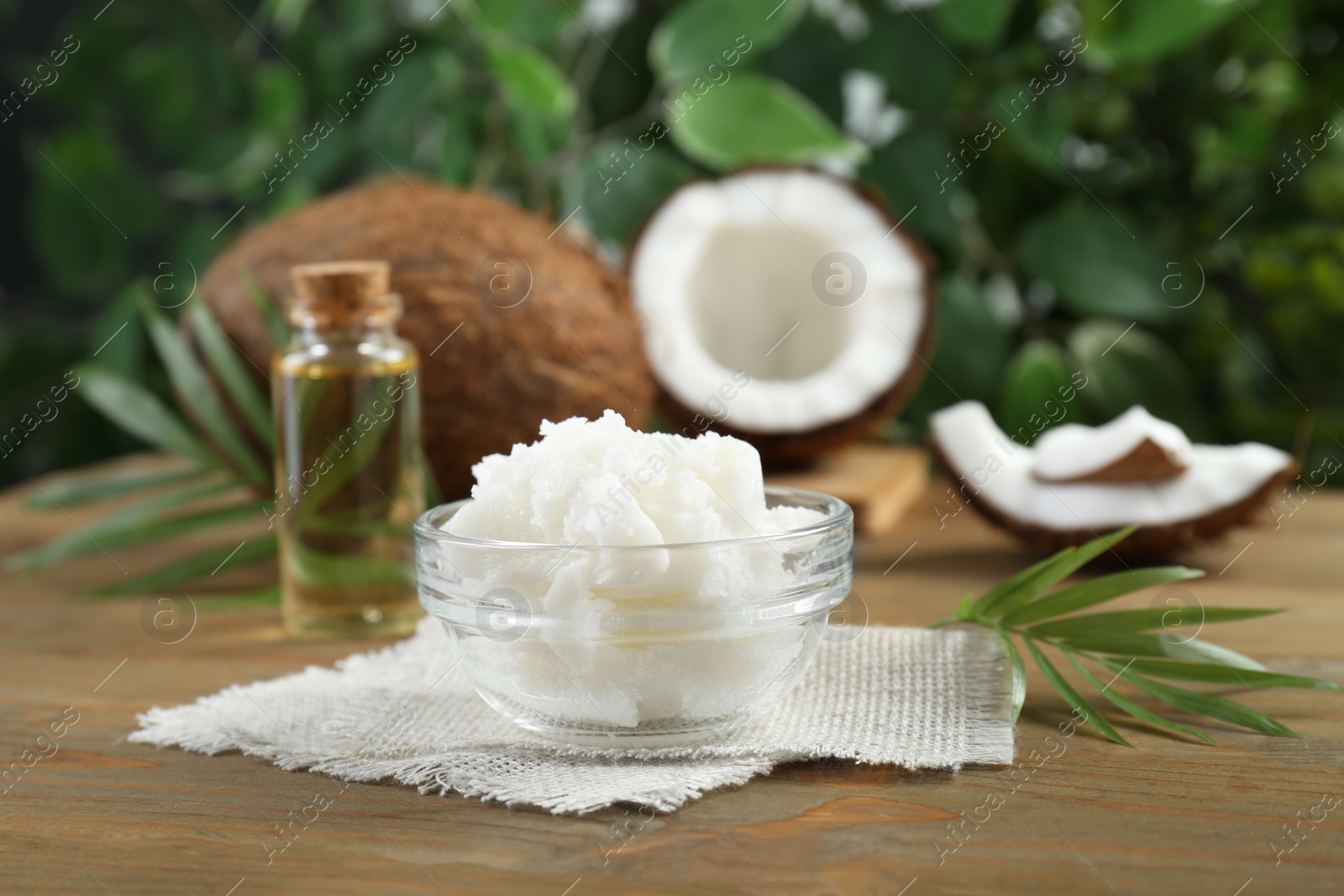 Photo of Organic coconut cooking oil on wooden table