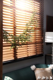 Photo of Stylish room decorated with beautiful eucalyptus garland