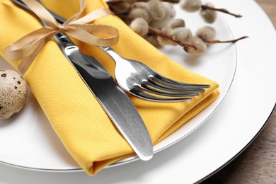 Photo of Festive Easter table setting with egg, closeup