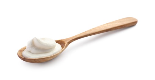 Photo of Sour cream in wooden spoon isolated on white